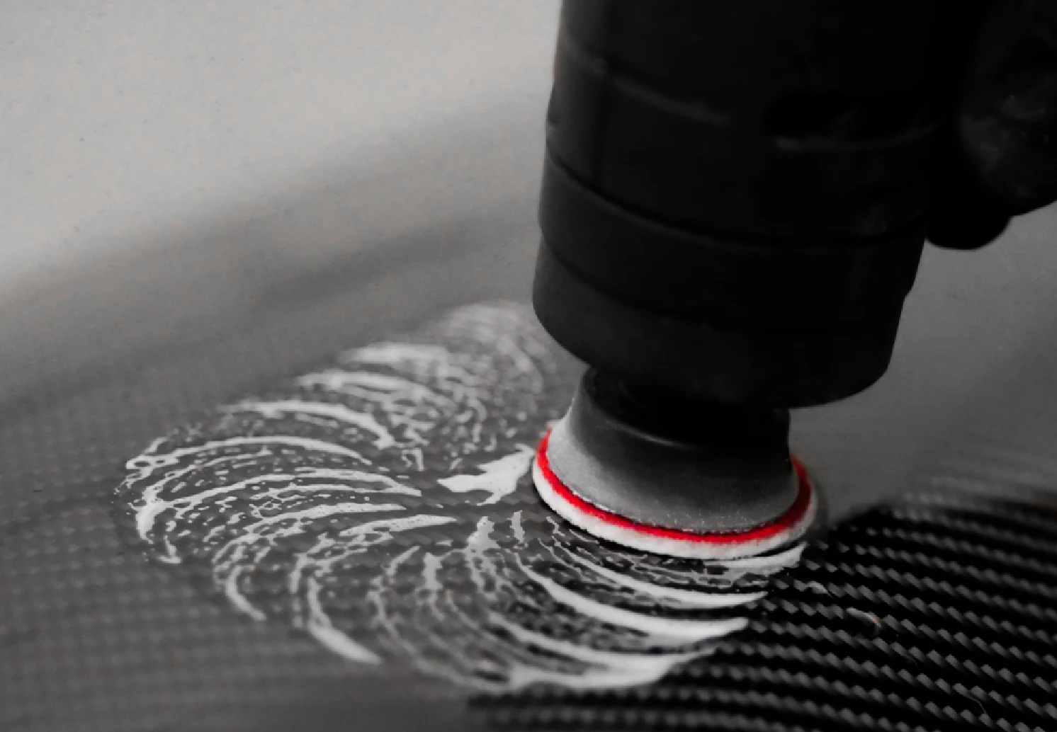 CARSYSTEM small polisher with a Proflex Styx pad polishing a surface.